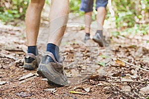 Hiking in the forest, closeup of feet of hiker