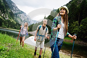 Hiking with friends is so fun. Group of young people with backpacks together