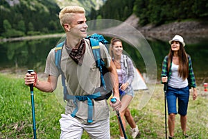 Hiking with friends is so fun. Group of young people with backpacks together