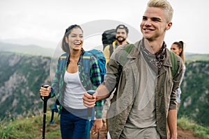 Hiking with friends is so fun. Group of young people with backpacks together