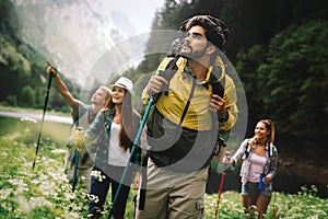 Hiking with friends is so fun. Group of young people with backpacks together