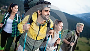 Hiking with friends is so fun. Group of young people with backpacks walking together