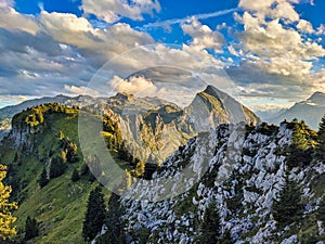 hiking in the Glarner Alp. View of the Fronalpstock mountain above Mollis. Beautiful sunset hike towards Nuenchamm