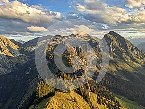 hiking in the Glarner Alp. View of the Fronalpstock mountain above Mollis. Beautiful sunset hike towards Nuenchamm