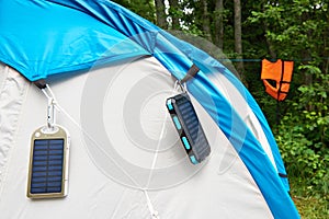 Hiking hand-held portable batteries solar panels on tent