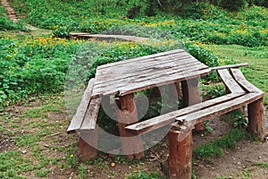 Hiking hearth for outdoor recreation. Wooden benches and table for eating