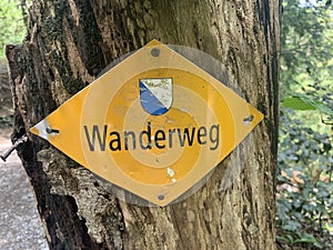 Wanderweg sign in yellow close to Zurich, Switzerland. Official hiking path indication photo