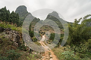 Hiking in the Karst mountains in Guilin region of South China, close to Xingping village, Li River