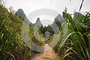 Hiking in the Karst mountains in Guilin region of South China, close to Xingping village, Li River