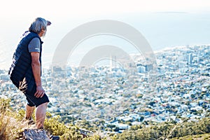 Hiking, looking and senior man explore a city view for on an adventure, workout and fitness in Cape Town. Training