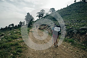 Hiking on Lycian way. Woman with backpack is trekking in beautiful nature