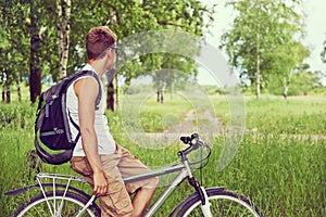 Hiking man on bicycle