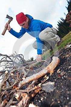 Hiking man try to light fire