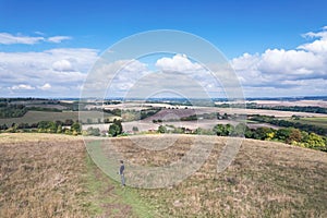 Hiking man walking in the field, Amazing view of Goring and Streatley, village town near Reading, England