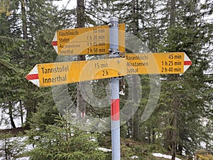 Hiking markings and orientation signs with signposts for navigating in the Wagital valley Waegital or WÃ¤gital and alpine Lake