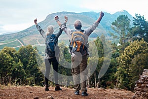 Hiking, mature couple and arms raised on cliff from back on nature walk and mountain in view in Peru. Travel, senior man