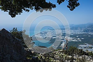 Hiking, outdoor activity, eco tourism in Turkey, Man with backpack enjoys view of Beymelek and Demre from Lycian Way