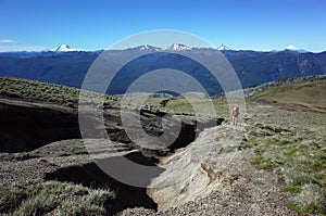 Hiking in Patagonia, Man solo walking up mountainside of volcano Puyehue in Puyehue National Park, Los Lagos Region