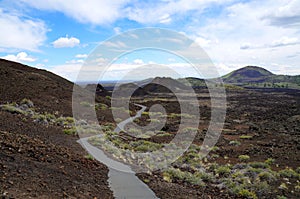 Hiking path along a chain of volcanic cinder and spatter cones