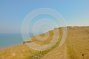 Hiking path along a field on the cliffs on the French Northe sea coast,