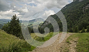 Hiking path in the Appenzeller mountains during a cloudy summer day. Walking path going to the Seealpsee in Switzeland