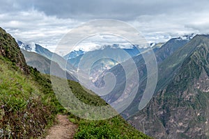 Hiking path at high altitude Peruvian mountains between Choquequirao and Maizal, Peru photo