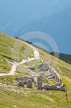 Hiking path on ruin of hut on mountain Hochobir, Austria