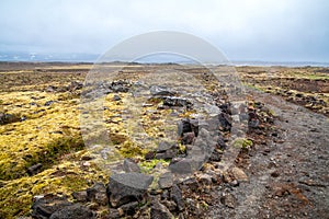 Hiking path to old volcano across Landmannalaugar moss and lava land. Iceland