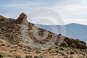 Hiking path up rocky desert landscape Sierra Nevada Alabama Hills