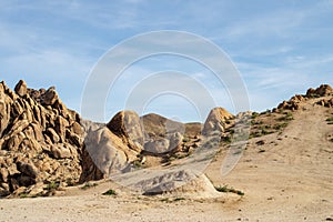 Hiking path up rocky desert landscape Sierra Nevada Alabama Hills