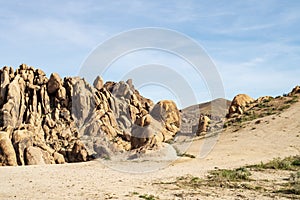 Hiking path up rocky desert landscape Sierra Nevada Alabama Hills