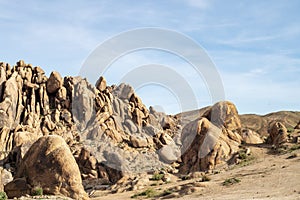 Hiking path up rocky desert landscape Sierra Nevada Alabama Hills