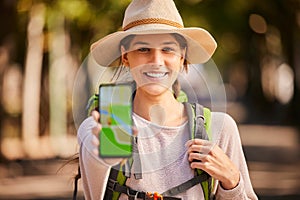 Hiking, phone and woman with gps, map and navigation app on screen while hiking in forest, happy and relax. Portrait