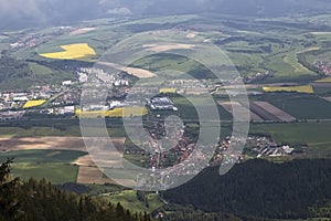 Hiking on the Poludnica hill, a view of Zavazna Poruba and a housing estate under the Baranec hill - Podbreziny, part of the town