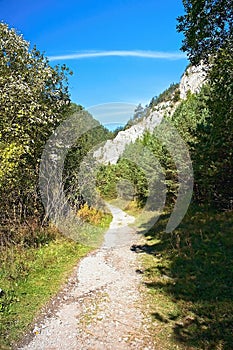 Hiking in the Prosiecko - Kvacianska valley is about landscaped pavements, surrounding rocks and coniferous trees in the