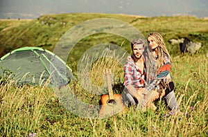 Hiking romance. Summer vacation. Boyfriend girlfriend guitar near camping tent. Couple in love happy relaxing nature
