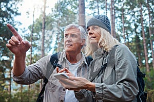 Hiking, senior couple and phone outdoor in nature for direction for exercise, fitness and trekking. Old man and woman