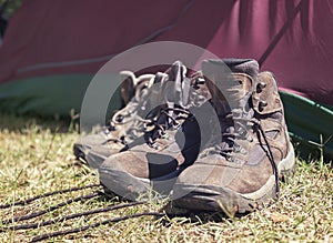 Hiking shoes in front of tent