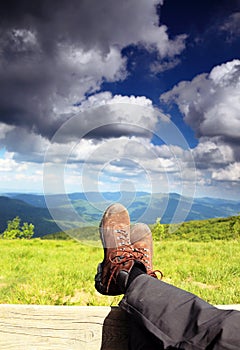 Hiking shoes. Hiker enjoying view relaxing