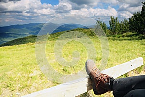 Hiking shoes. Hiker enjoying view relaxing