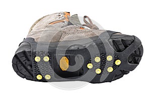 Hiking shoes with spikes on a white background