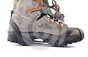 Hiking shoes with spikes on a white background