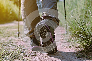 Hiking shoes woman in beautiful rock trail,Hiker trekking or walking at nature,Close up