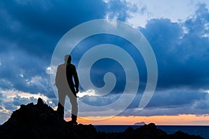 Hiking silhouette backpacker, inspirational sunset landscape