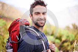 Hiking, smile and portrait of man on mountain for fitness, adventure and travel journey. Backpacking, summer and workout