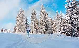 Hiking in the snow on a mountain slope in winter