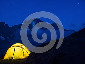 Hiking tent in the italian alps at night photo