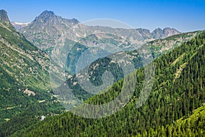 Hiking to Argentiere glacier with the view on the massif des Aiguilles Rouges in French Alps