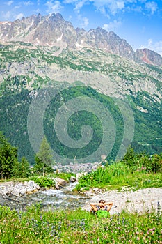 Hiking to Argentiere glacier with the view on the massif des Aiguilles Rouges in French Alps