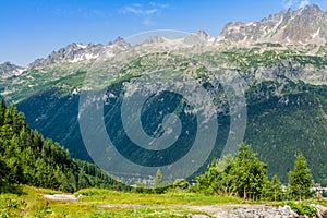 Hiking to Argentiere glacier with the view on the massif des Aiguilles Rouges in French Alps